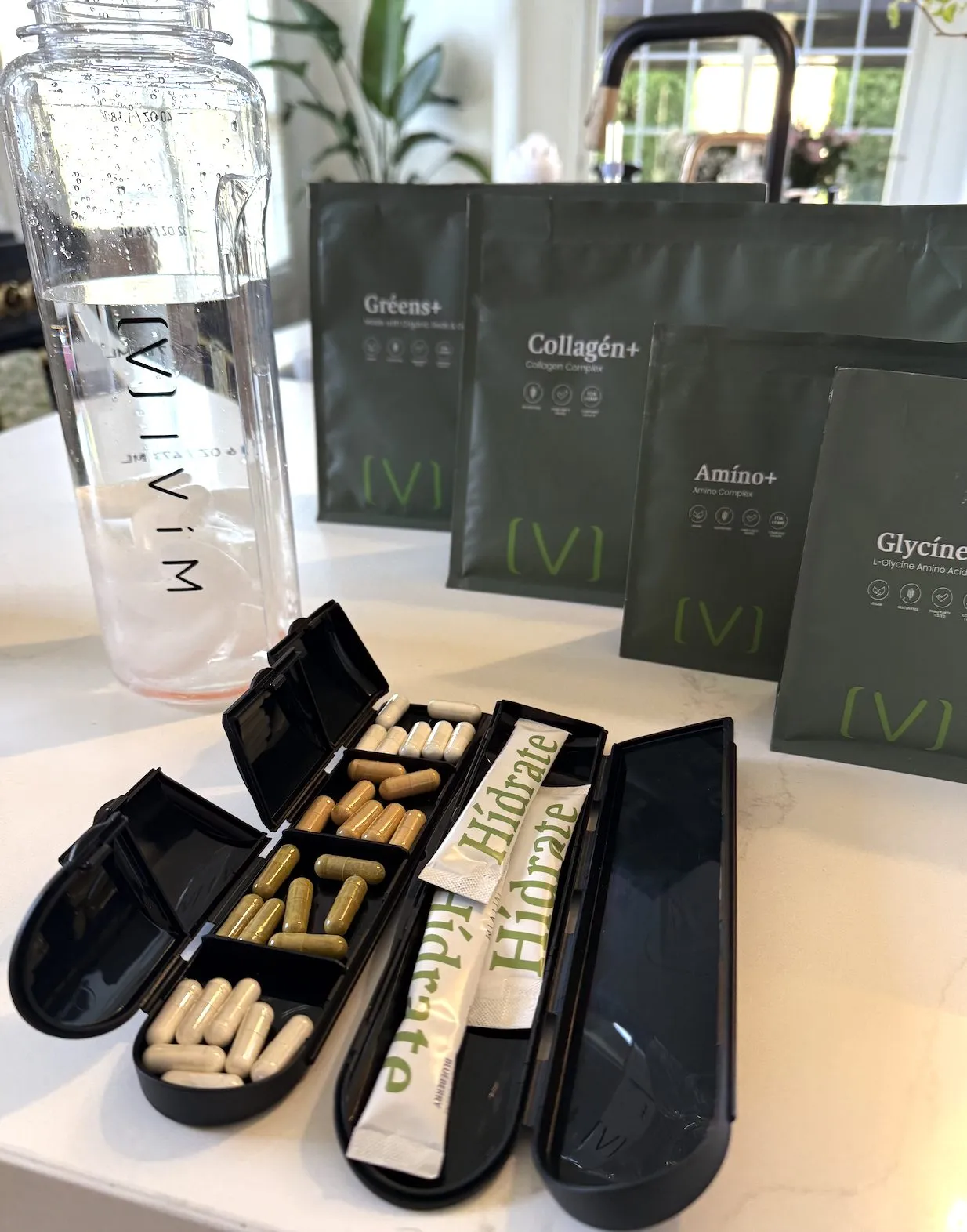 Pill organizer and Hidrate packets beside Ivím pouches