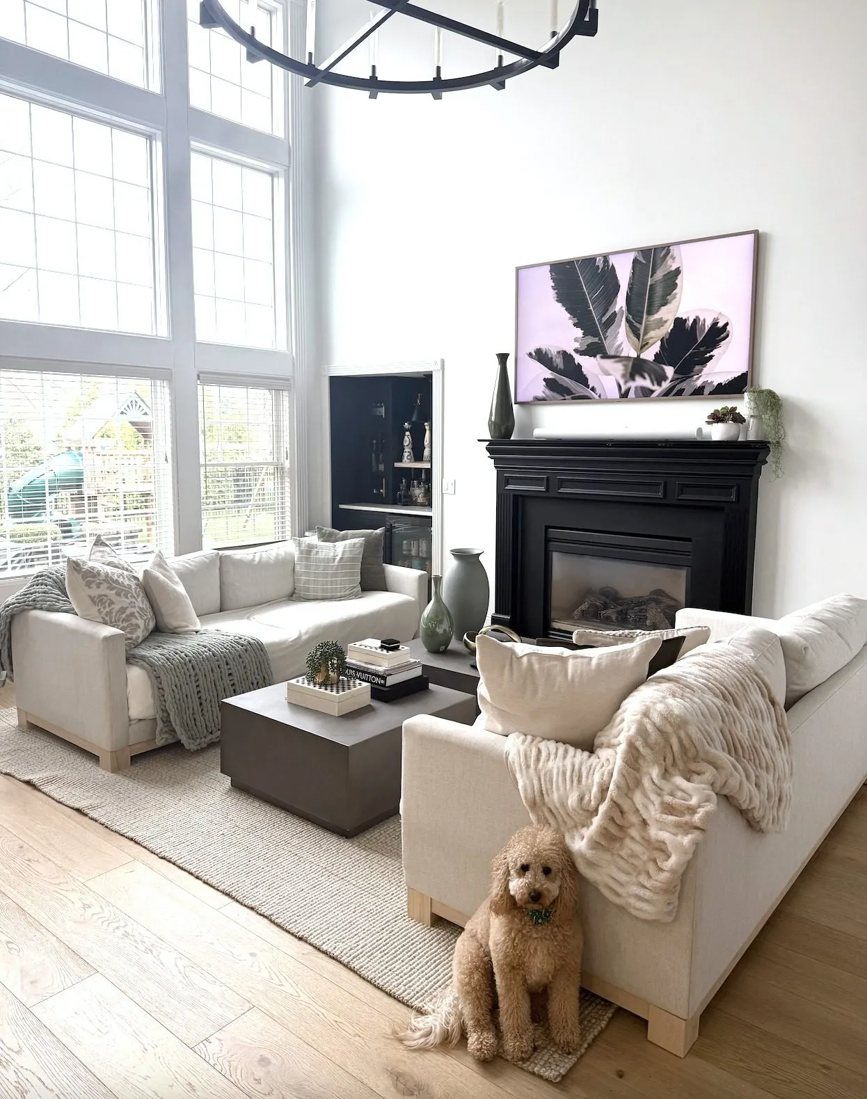 The great room filled with natural light from two-story windows
