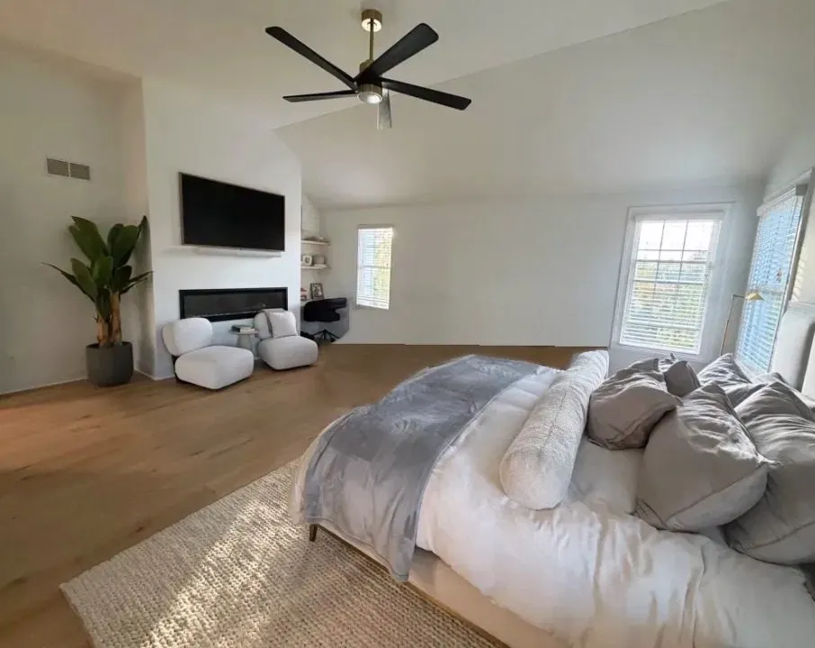 Bright primary bedroom with vaulted ceiling